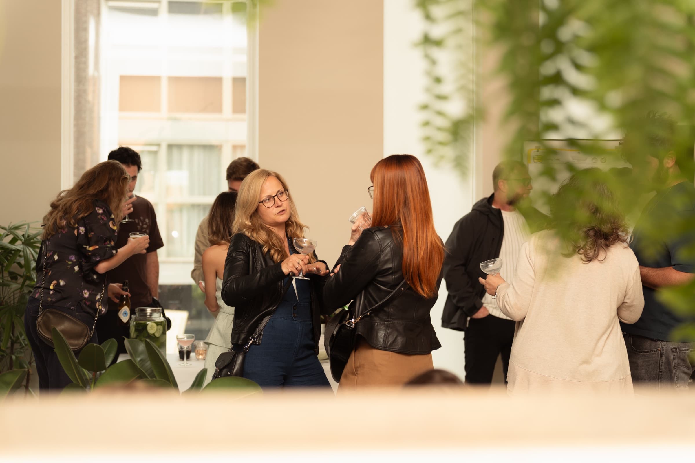 Guests networking with drinks at an event