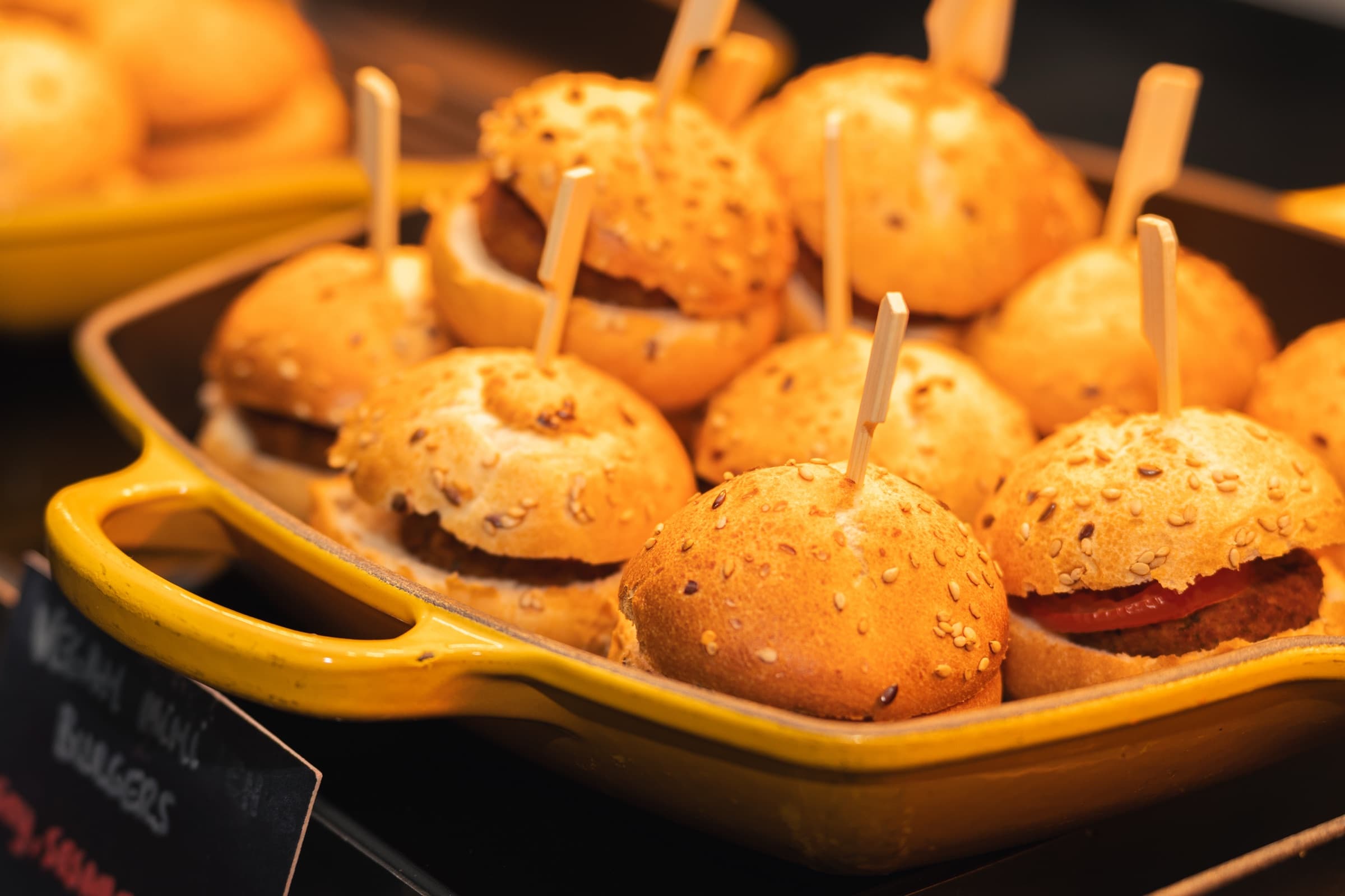 Close-up of gourmet sliders served on a tray